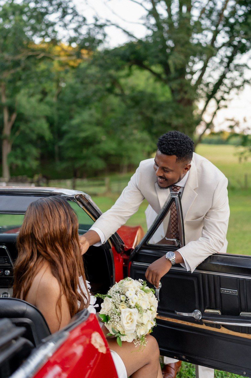 Tariku helping Meskerem into the car